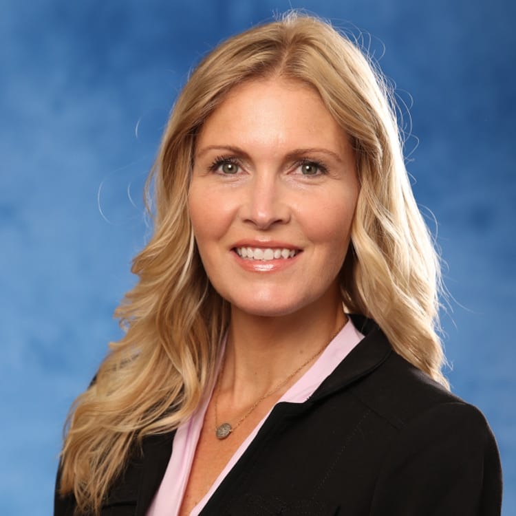 a woman smiling for the camera